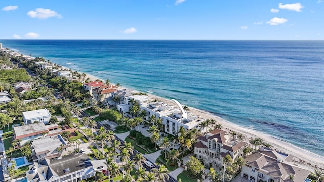 bird's eye view with a beach view and a water view