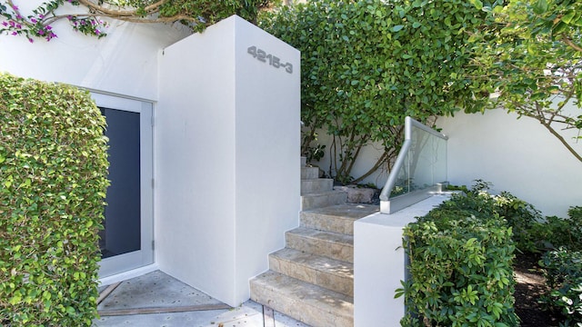 doorway to property with stucco siding