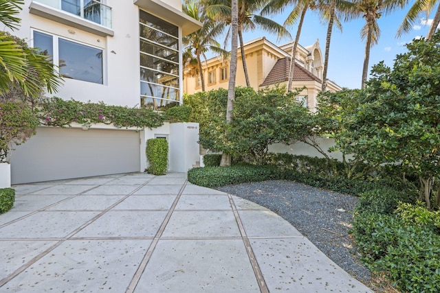 exterior space with an attached garage and concrete driveway