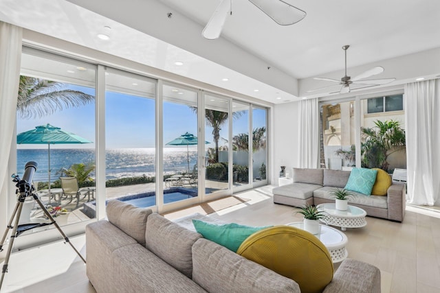 living area featuring recessed lighting, floor to ceiling windows, a ceiling fan, and wood finished floors