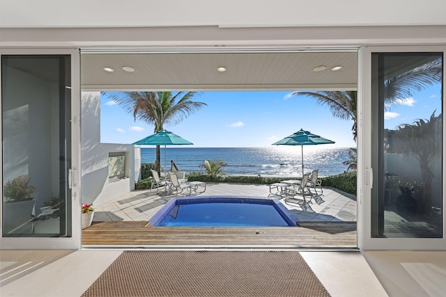 view of pool featuring a water view