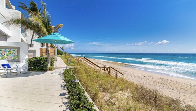 property view of water featuring a beach view