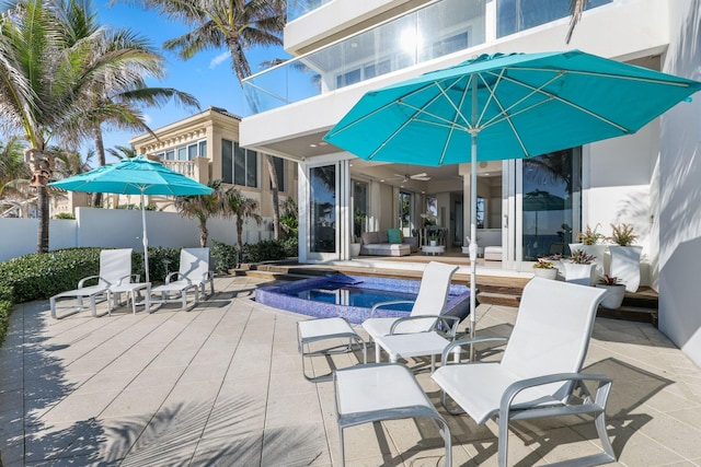 view of swimming pool featuring a fenced in pool, a patio, an in ground hot tub, and fence