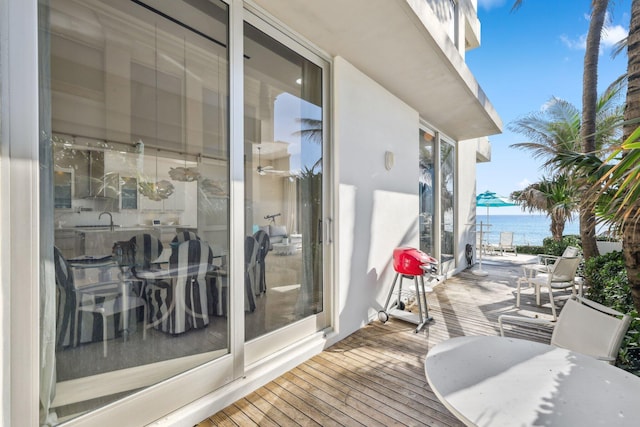 deck with a sink and a water view