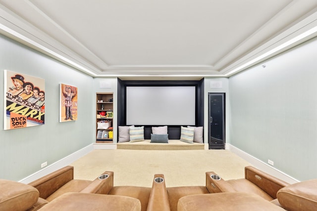 carpeted cinema room featuring built in features and baseboards