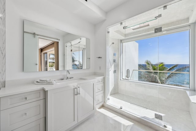 bathroom featuring a stall shower and vanity