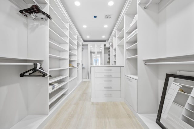 walk in closet with visible vents and light wood-style floors