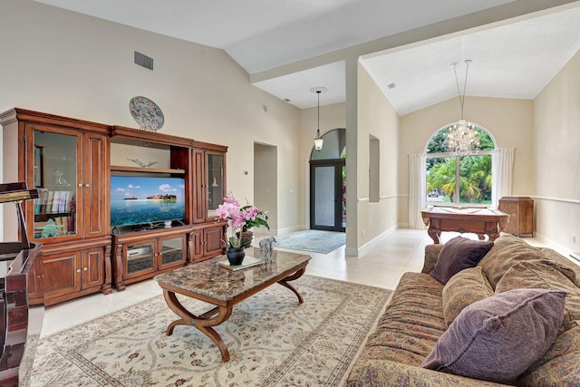 living room featuring light tile patterned floors, high vaulted ceiling, a chandelier, visible vents, and baseboards