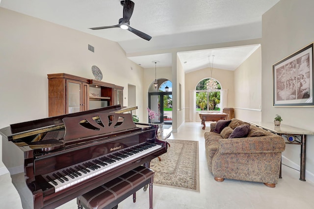 sitting room featuring lofted ceiling, ceiling fan, visible vents, and baseboards