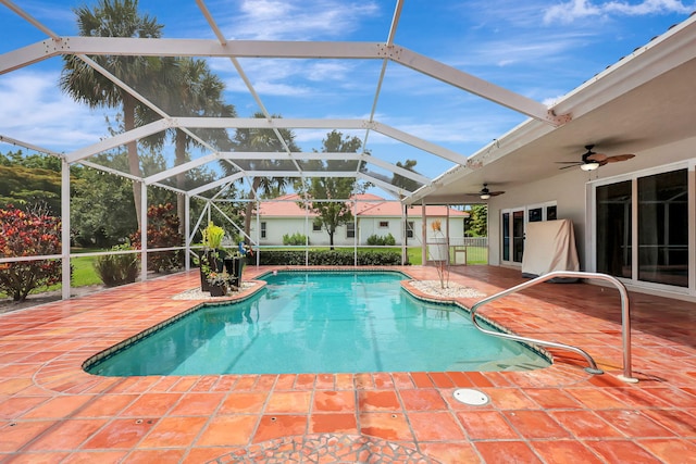 outdoor pool featuring a lanai, a patio, and ceiling fan