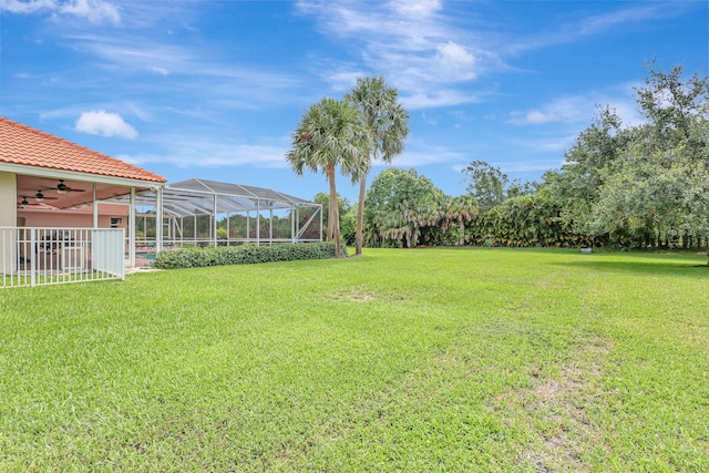 view of yard with a lanai and a carport