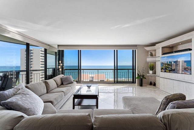 living area with light tile patterned floors and floor to ceiling windows