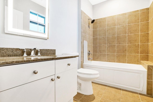 bathroom featuring tile patterned flooring, shower / bath combination, vanity, and toilet