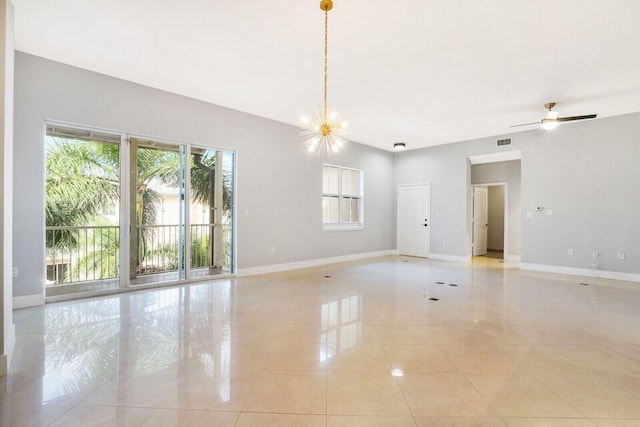 unfurnished room featuring light tile patterned floors, ceiling fan with notable chandelier, visible vents, and baseboards