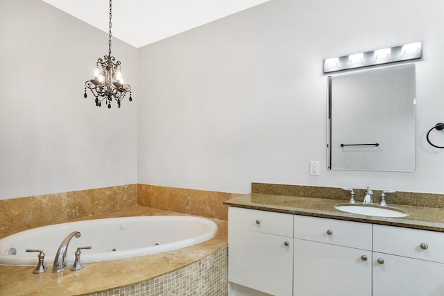 bathroom featuring vaulted ceiling, a jetted tub, and vanity