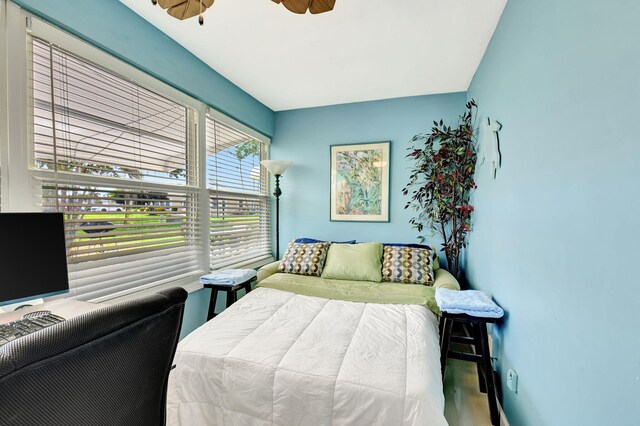 home office with ceiling fan and baseboards