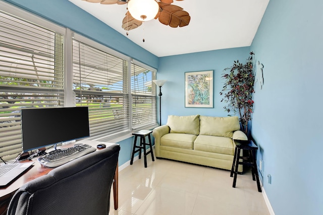 office with a ceiling fan, tile patterned flooring, and baseboards