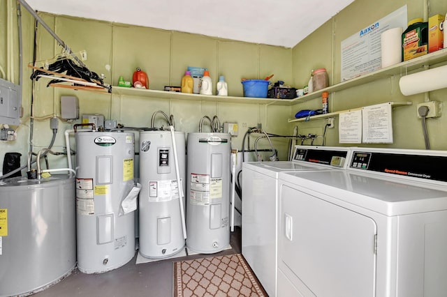 washroom with water heater and washing machine and clothes dryer