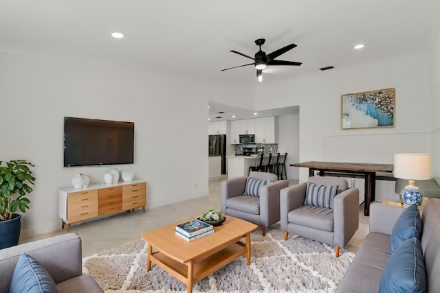 living room with recessed lighting, visible vents, baseboards, and ceiling fan