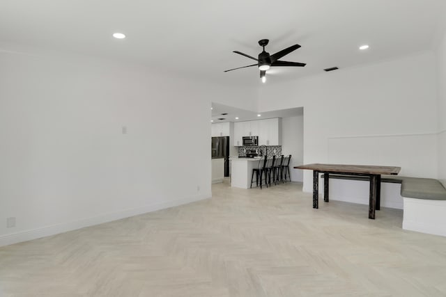 interior space with visible vents, crown molding, baseboards, recessed lighting, and a ceiling fan