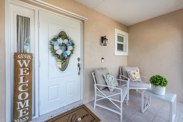 property entrance with stucco siding