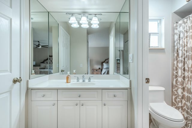 full bath featuring toilet, ensuite bath, and vanity