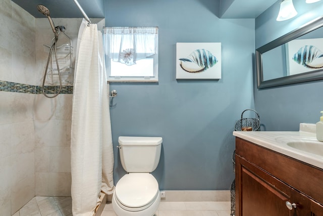 full bath with toilet, tiled shower, vanity, and tile patterned floors