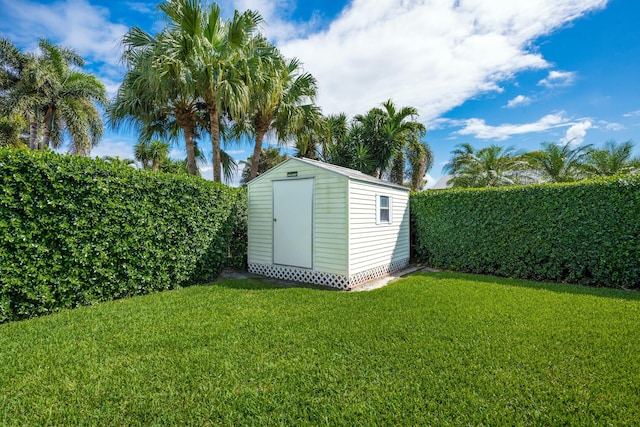 view of shed featuring a fenced backyard