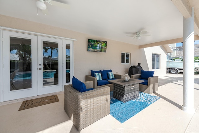 view of patio with french doors, ceiling fan, and an outdoor living space