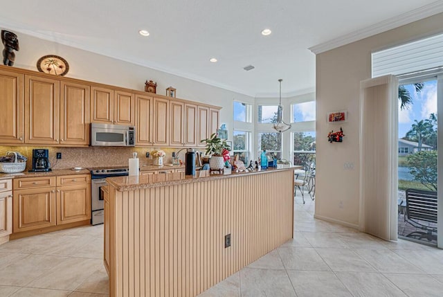 kitchen with appliances with stainless steel finishes, plenty of natural light, crown molding, and backsplash