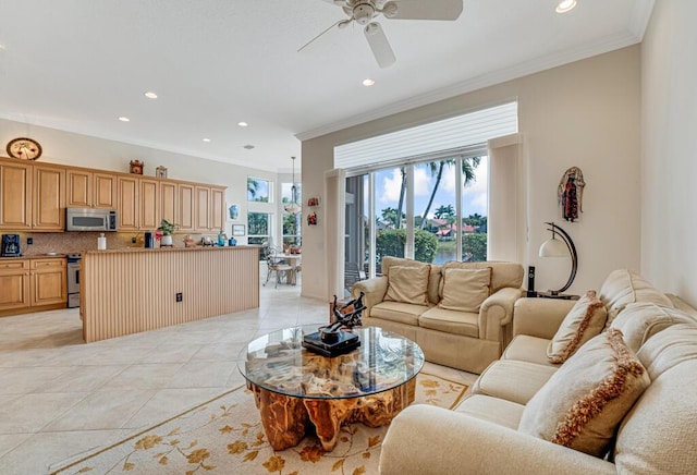 living area with recessed lighting, ornamental molding, a ceiling fan, and light tile patterned flooring