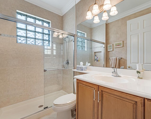 bathroom with a notable chandelier, crown molding, toilet, a shower stall, and vanity