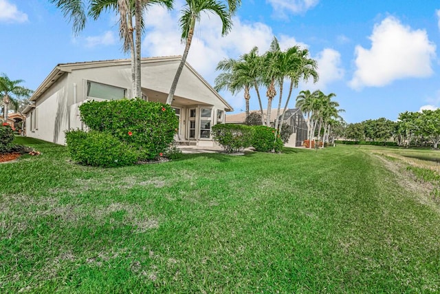 view of yard with a lanai