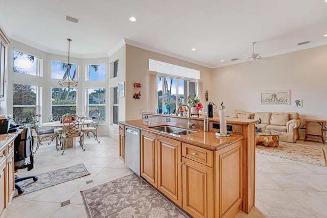 kitchen featuring dishwasher, crown molding, visible vents, and a sink