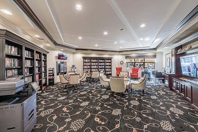 carpeted dining space with ornamental molding, a tray ceiling, and recessed lighting