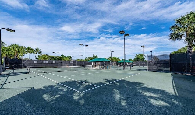 view of sport court with fence