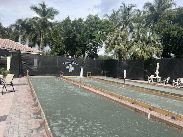 view of pool featuring fence