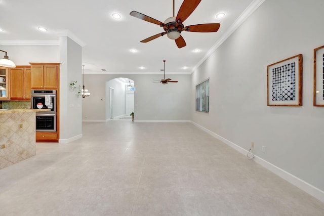 unfurnished living room with arched walkways, crown molding, baseboards, and ceiling fan with notable chandelier