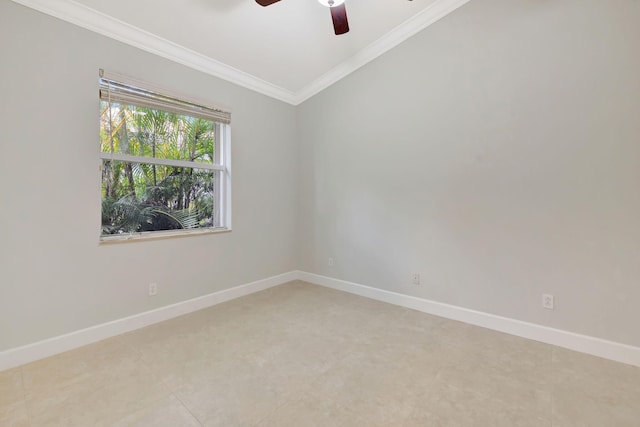 spare room featuring baseboards, ornamental molding, and a ceiling fan