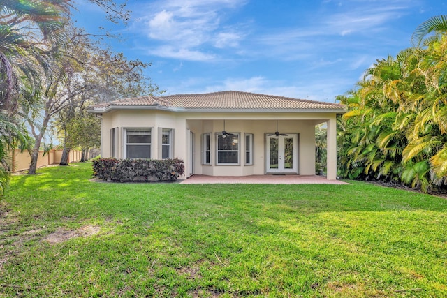 back of house featuring french doors, a lawn, a patio area, ceiling fan, and fence