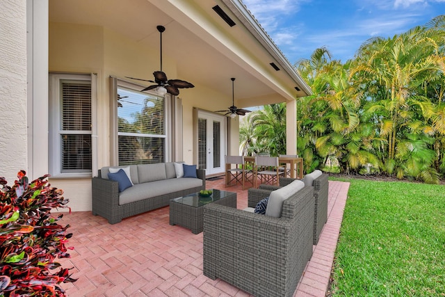 view of patio / terrace with french doors, an outdoor living space, and a ceiling fan