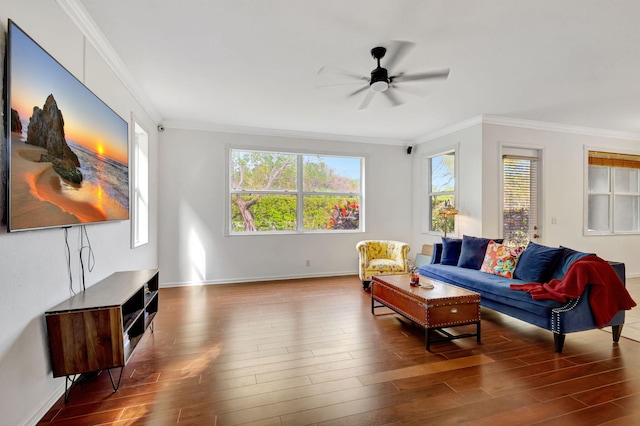 living area with crown molding, baseboards, ceiling fan, and wood finished floors