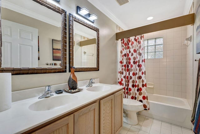 bathroom with crown molding, a sink, and toilet