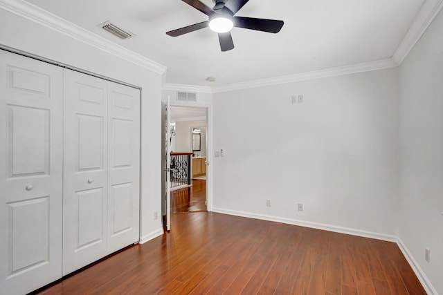 bedroom featuring dark wood-type flooring, a closet, and baseboards