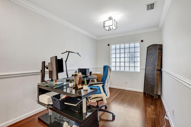 office area with baseboards, visible vents, ornamental molding, and hardwood / wood-style floors