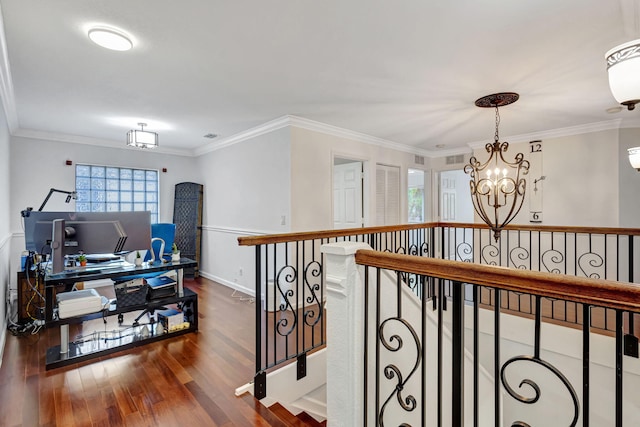 hallway with ornamental molding, dark wood finished floors, an upstairs landing, and baseboards