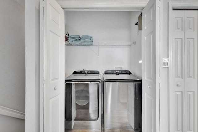 clothes washing area featuring laundry area and independent washer and dryer