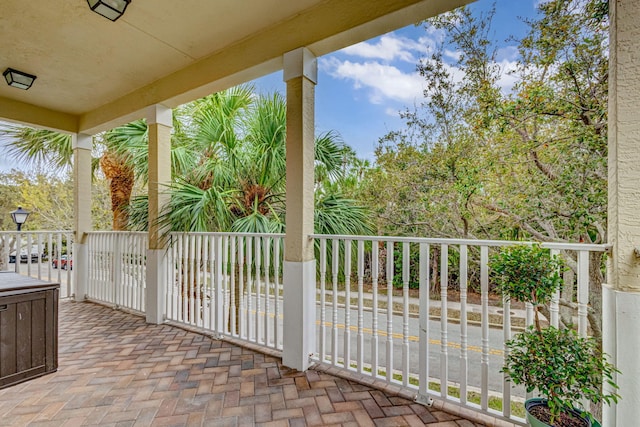 view of patio featuring a balcony