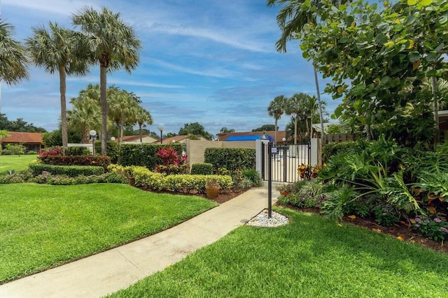 view of yard featuring fence and a gate