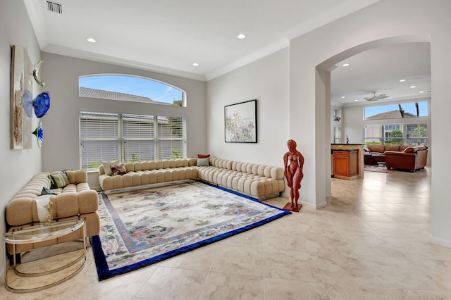 living room with recessed lighting, visible vents, baseboards, and ornamental molding